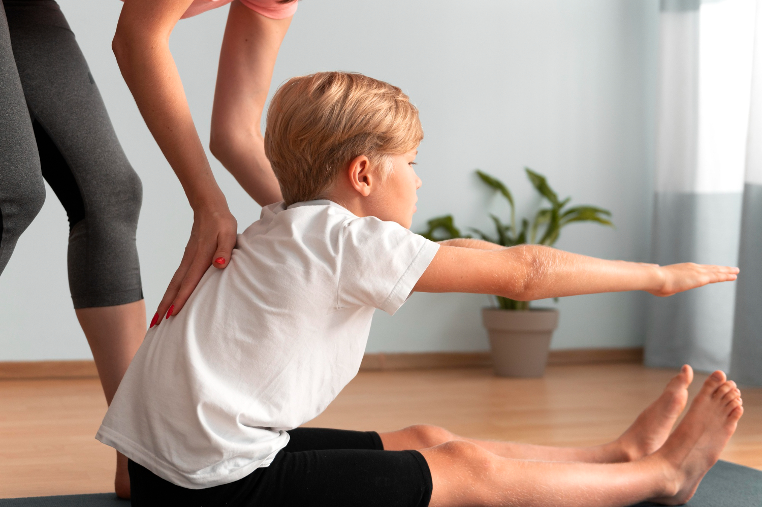 A young boy in a chiropractic session.
